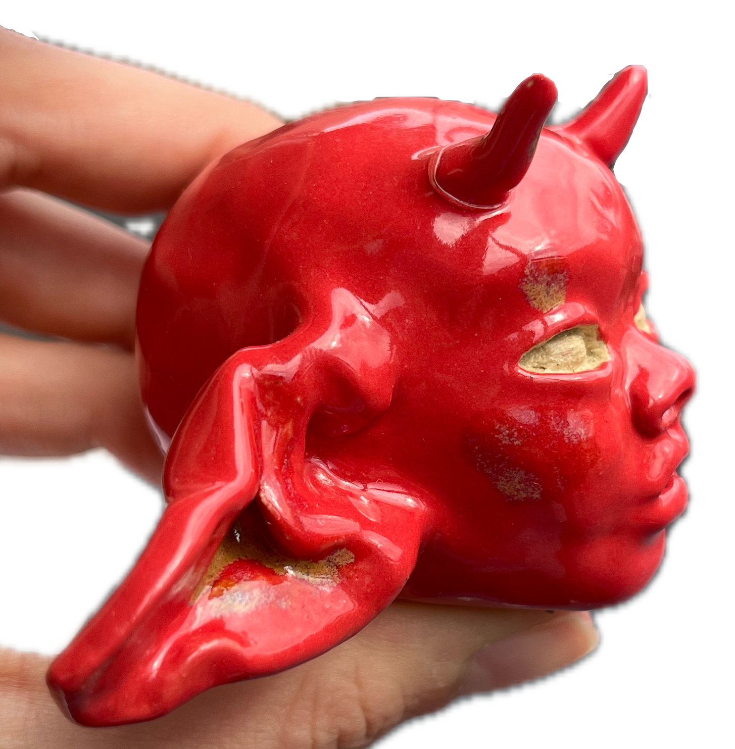 red devil head sculpture